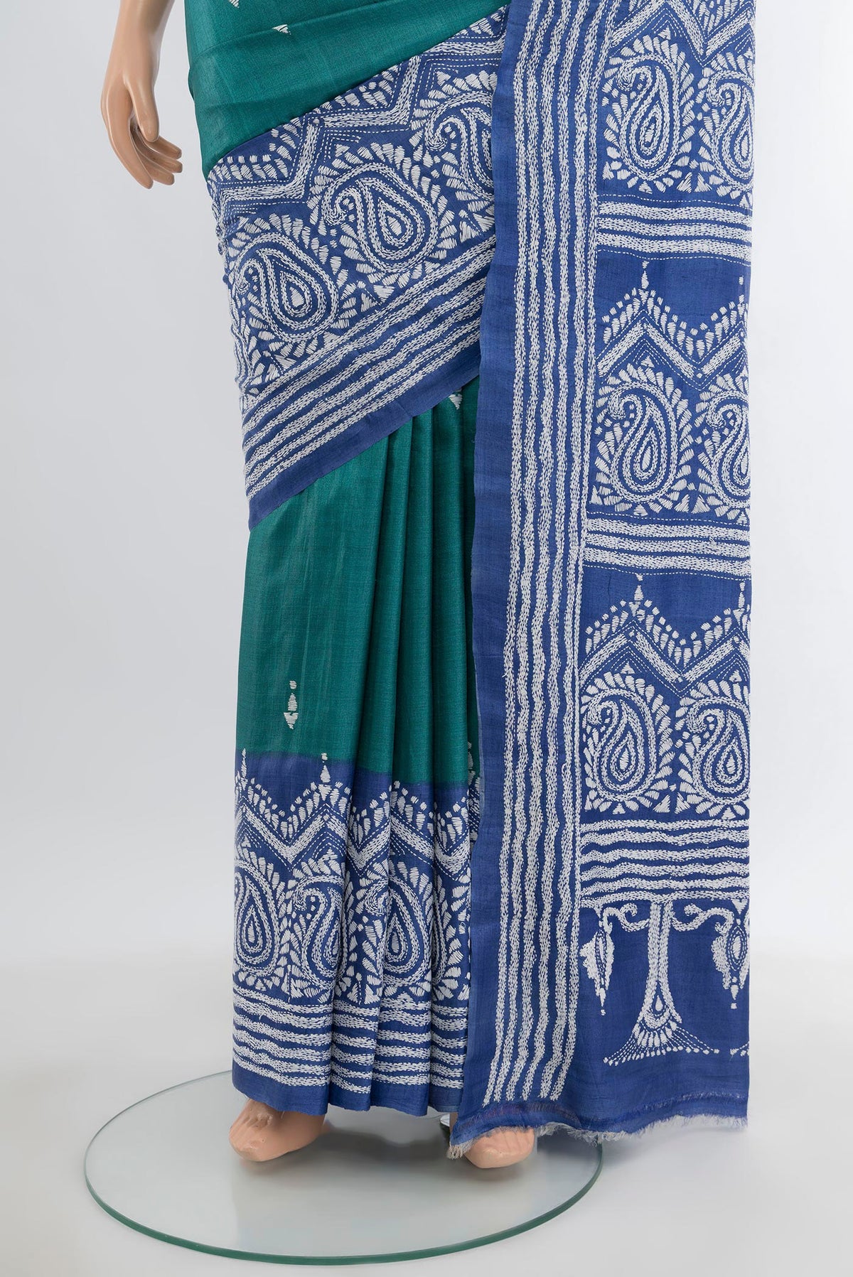 Pleats and pallu of Green Tussar Silk Saree with Kantha Work on the body and Embroidery Border. 