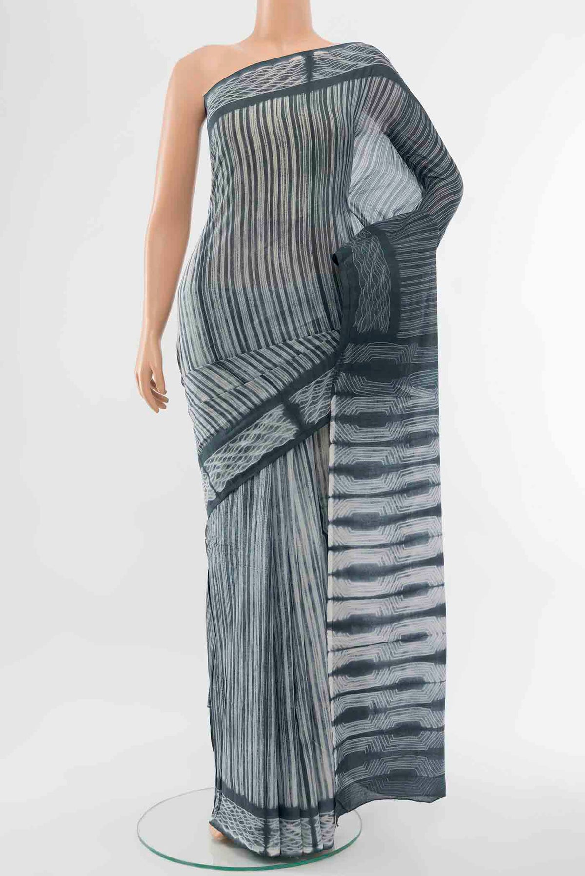 Grey Maheshwari Silk Cotton Saree with Thread Butta on the body and Thread Border displayed on a mannequin