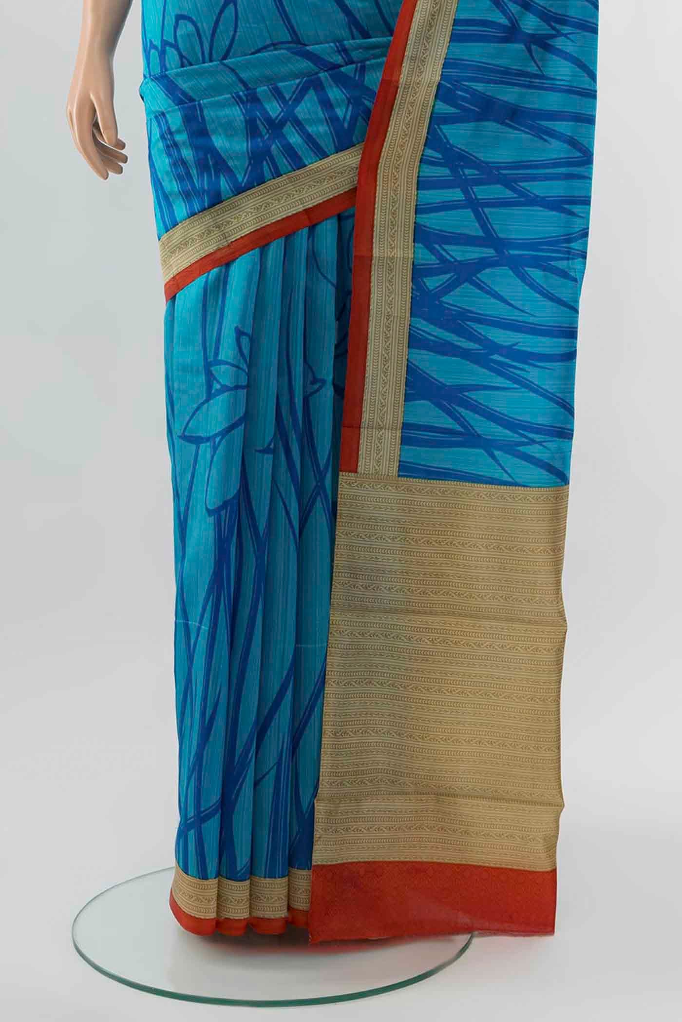 Pleats and pallu of Light Blue Tussar Silk Saree with Floral Print on the body and Silk Border