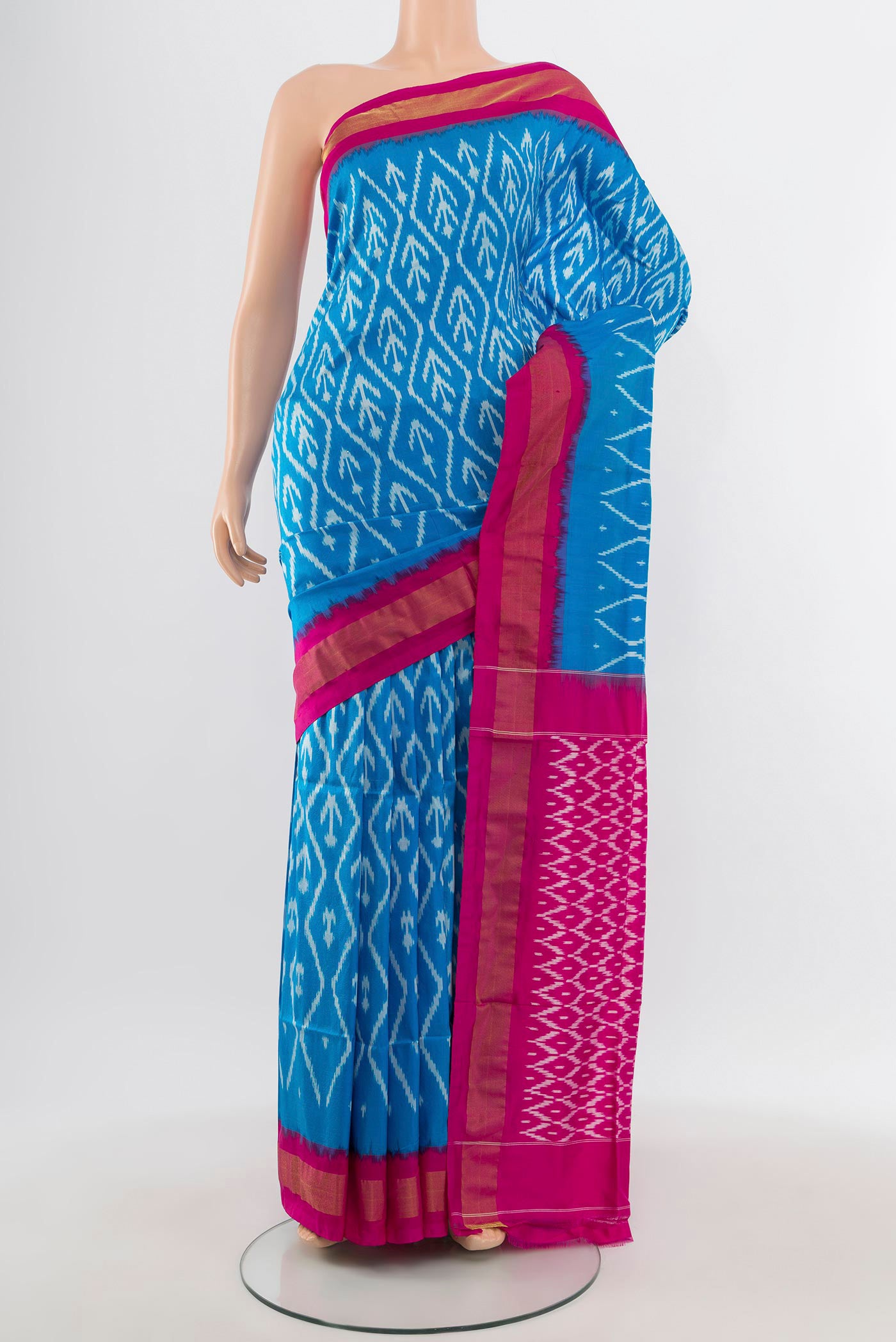 Sky Blue Pochampally Silk Saree with Ikat design on the body and Zari Border.  displayed on a mannequin