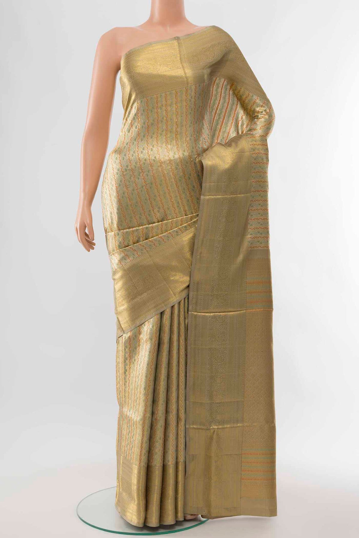Golden Kanchipuram Silk Saree with Zari Brocade on the body and Silk Border displayed on a mannequin