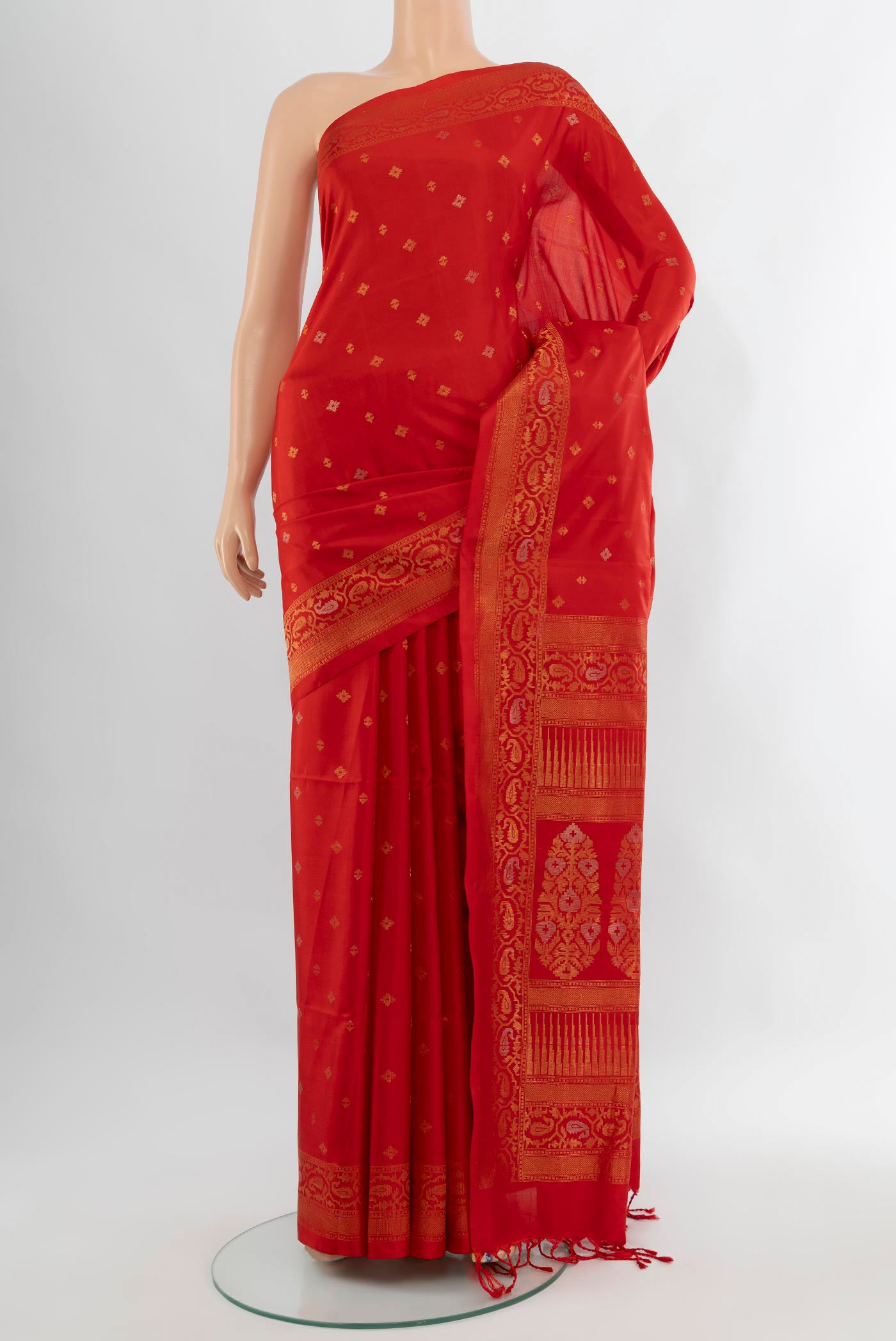 Red Soft Silk Saree with Zari Butta on the body and Zari Border.  displayed on a mannequin