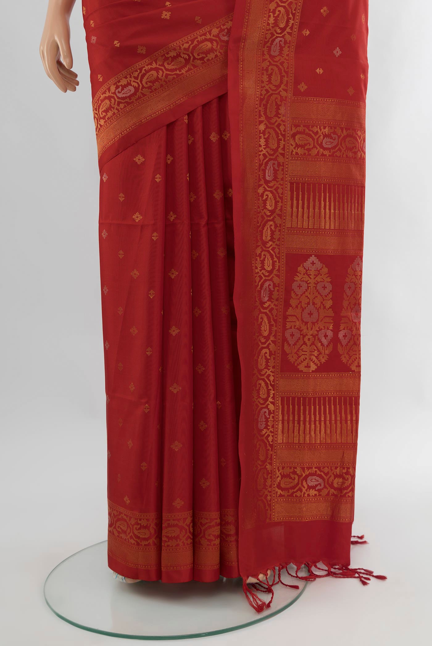 Pleats and pallu of Red Soft Silk Saree with Zari Butta on the body and Zari Border. 