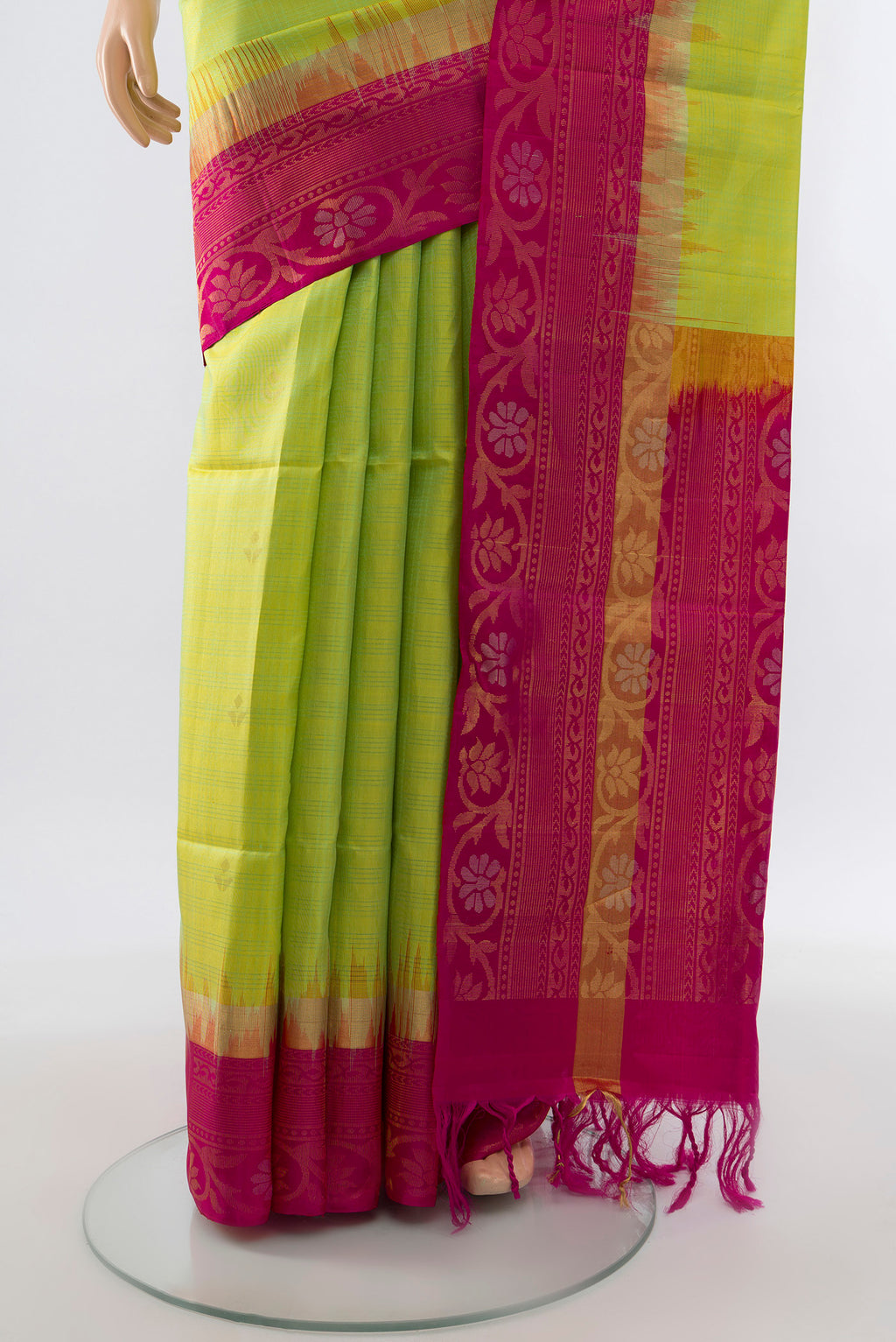 Pleats and pallu of Light Green Soft Silk Saree with Zari Butta on the body and Silk Border. 