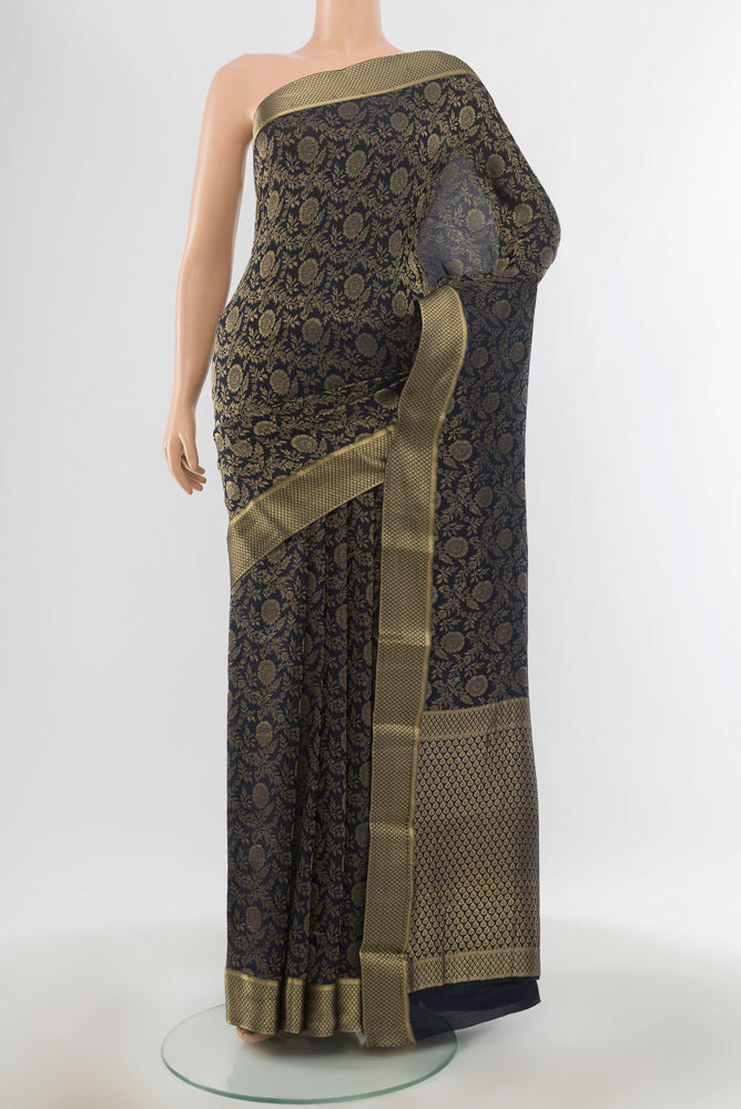 Pure Silk Pure Zari Navy Blue Mysore Georgette Saree with Zari Butta on the body and Silk Border.  displayed on a mannequin