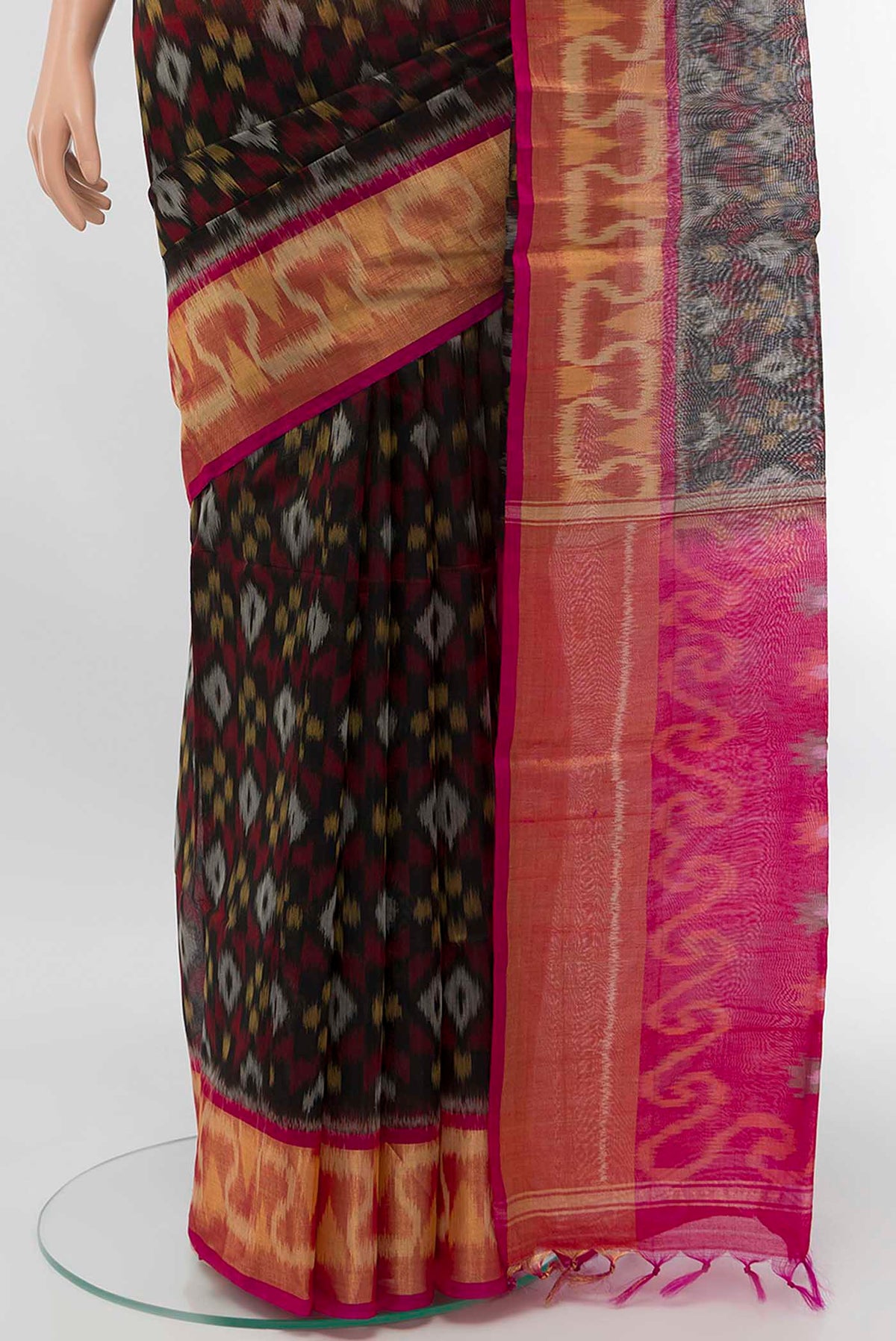 Pleats and pallu of Black Silk Cotton Saree with Zari Butta on the body and Silk Border