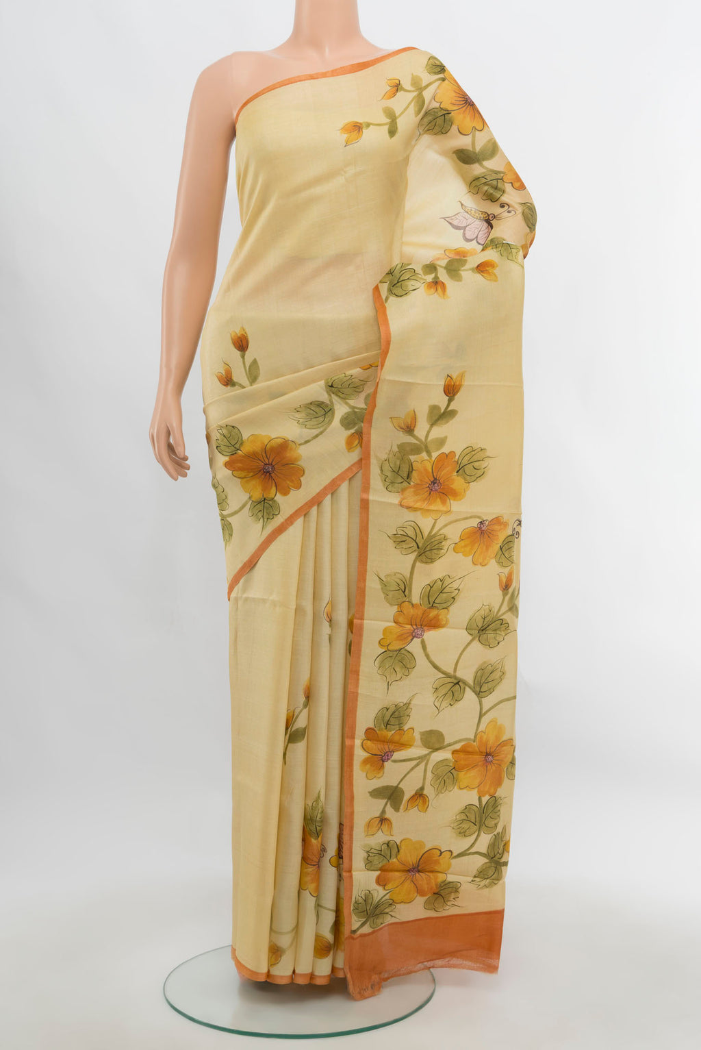 Cream Tussar Silk Saree with Floral Print on the body and Fancy Border.  displayed on a mannequin