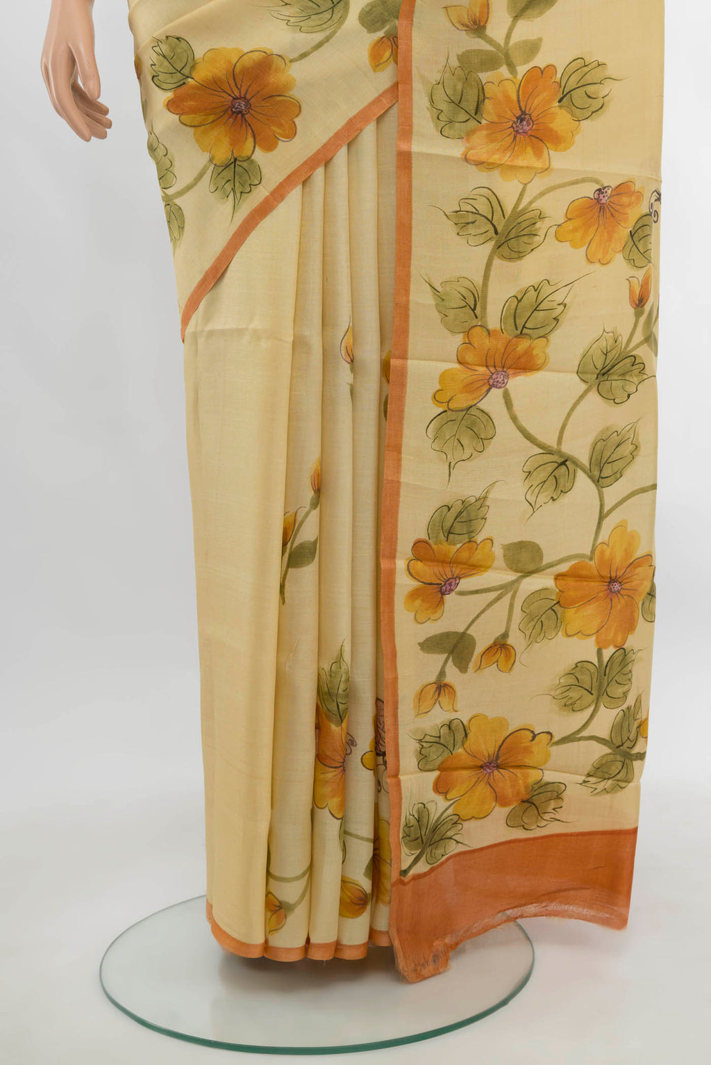 Pleats and pallu of Cream Tussar Silk Saree with Floral Print on the body and Fancy Border. 