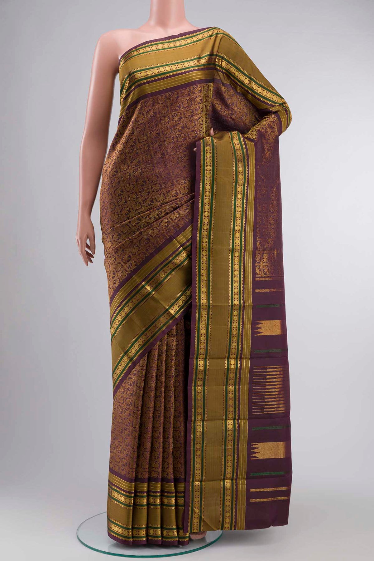 Burgundy Kanchipuram Silk Saree with Zari Brocade on the body and Zari Border displayed on a mannequin