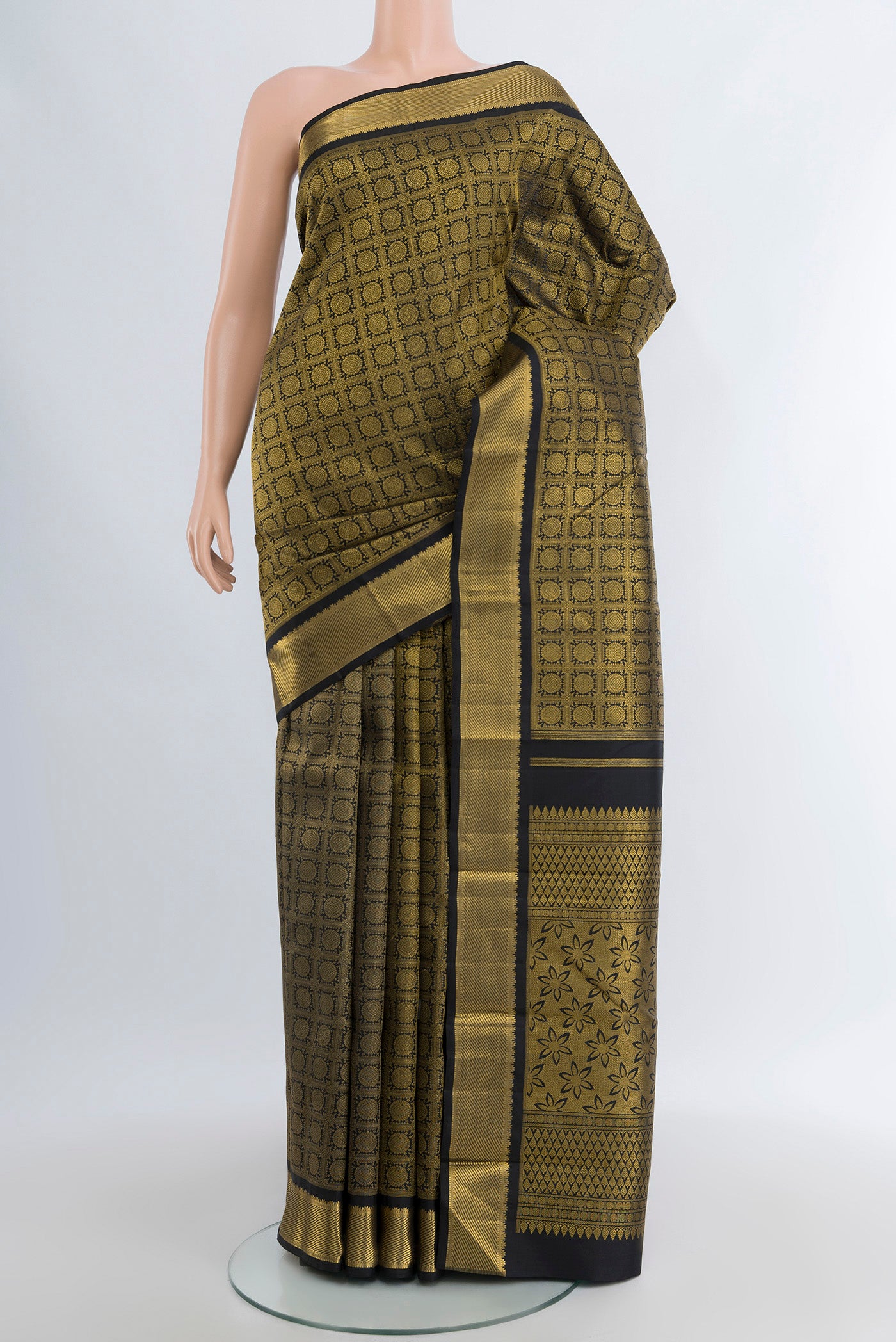 Pure Silk Pure Zari Black Kanjivaram Saree with Zari Brocade on the body and Zari Border.  displayed on a mannequin