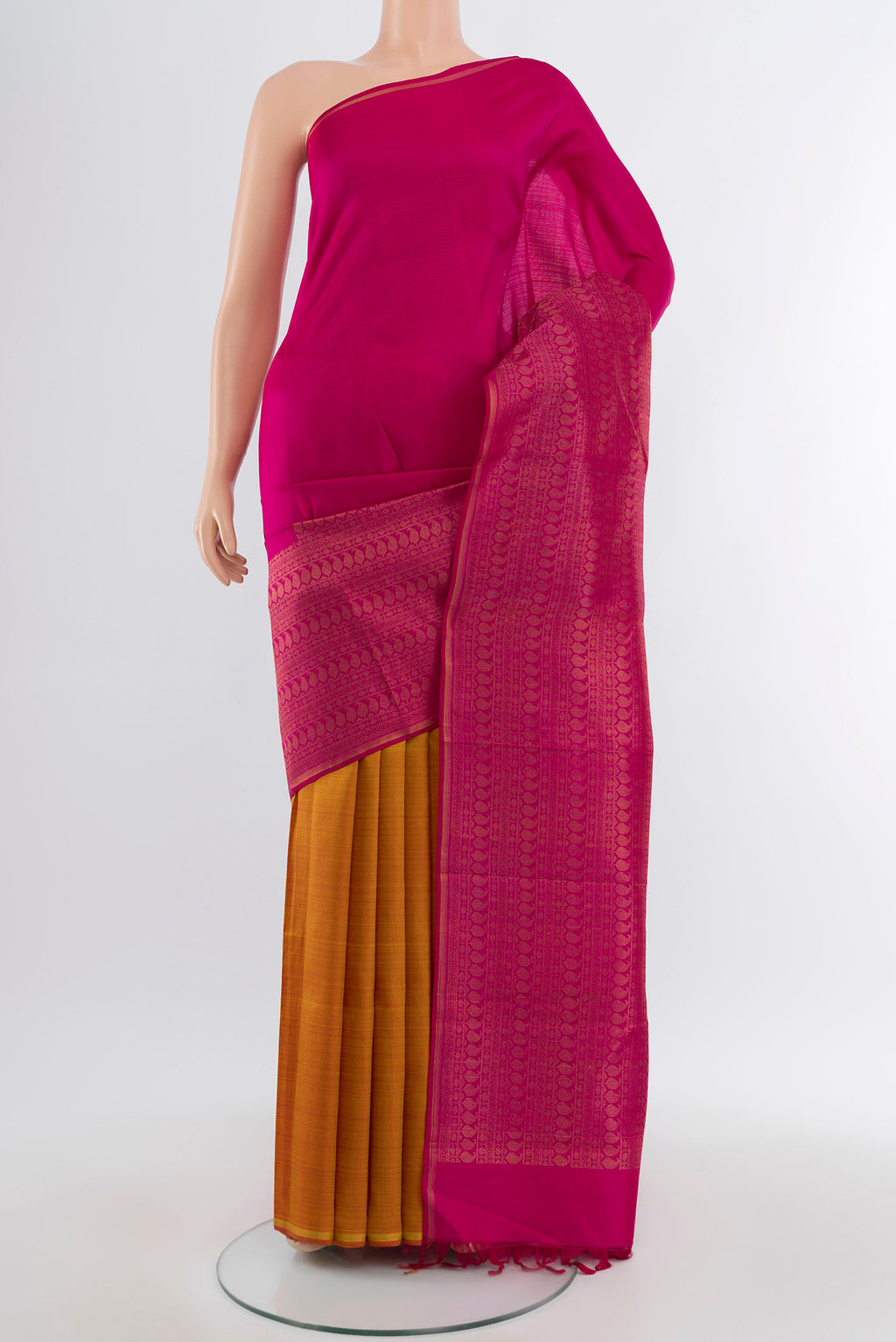 Dark Pink Kanchipuram Silk Saree with Zari Butta on the body and Silk Border.  displayed on a mannequin