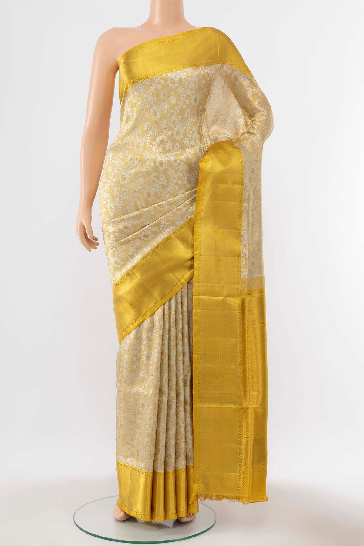 Pure Silk Pure Zari Golden Kanchipuram Tissue Saree with Zari Brocade on the body and Zari Border displayed on a mannequin