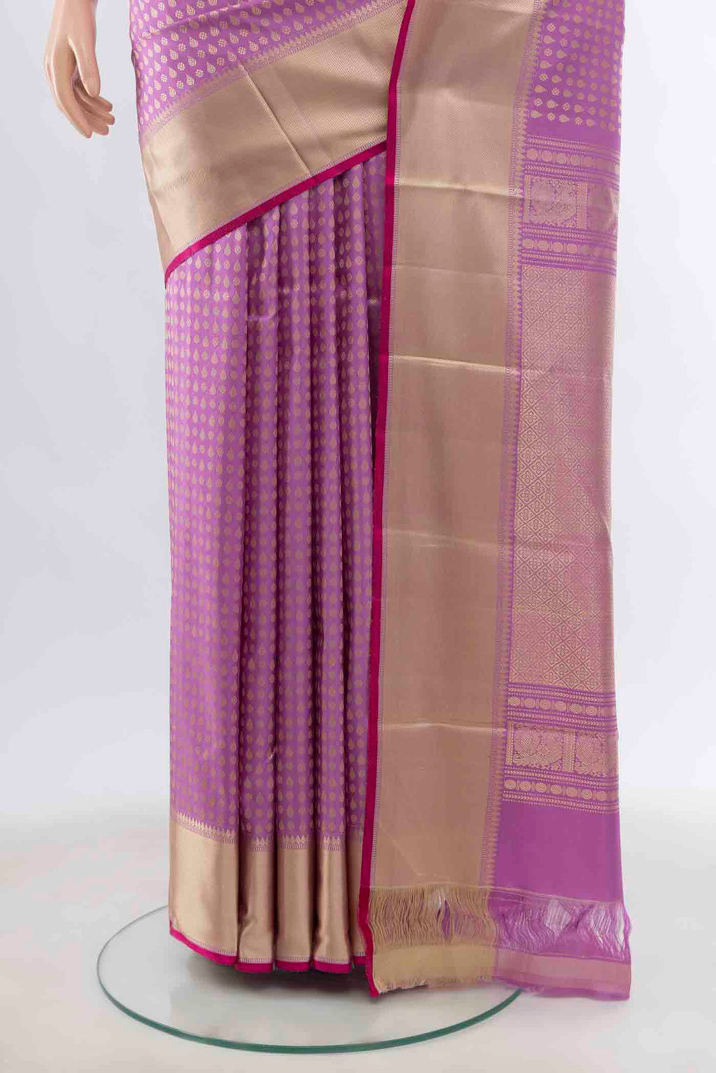 Pleats and pallu of Lavender Kanchipuram Silk Saree with Zari Butta on the body and Silk Border
