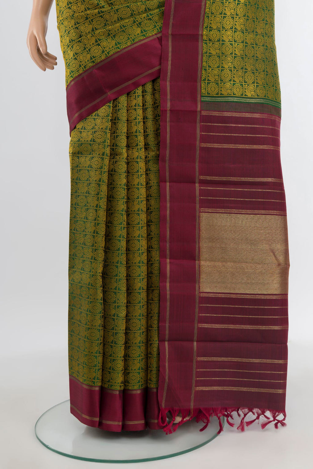 Pleats and pallu of Pure Silk Pure Zari Bottle Green Kanchipuram Saree with Jacquard With Thread Butta on the body and Plain Border. 