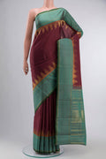 Maroon Kanchipuram Silk Saree with Plain Body and Zari Border displayed on a mannequin