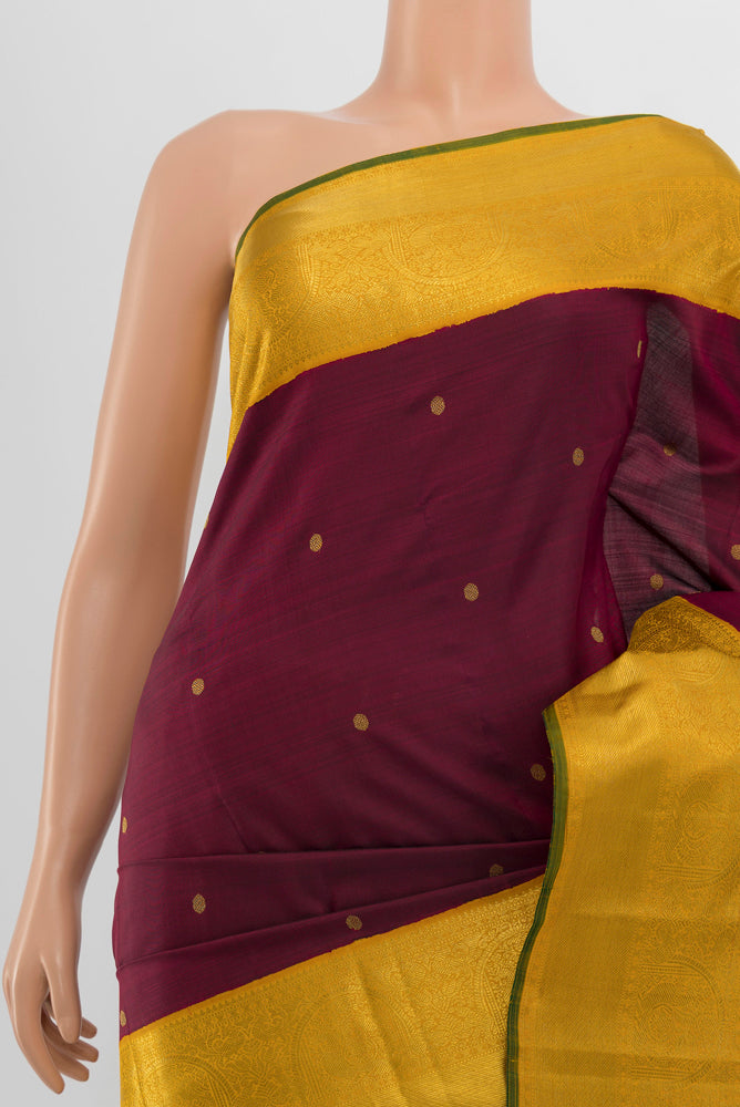 Border image of Pure Silk Pure Zari Maroon Kanjivaram Saree with Zari Butta on the body and Silk Border. 