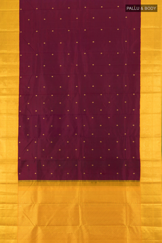 Flat view of Pure Silk Pure Zari Maroon Kanjivaram Saree with Zari Butta on the body and Silk Border. 
