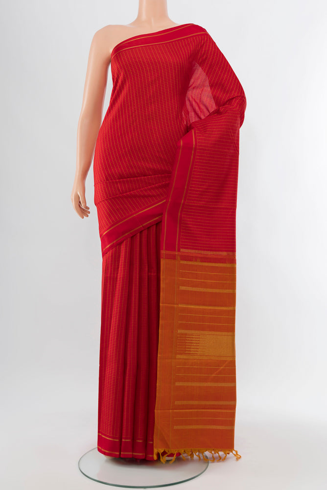 Red Kanjivaram Silk Saree with Zari Butta on the body and Silk Border.  displayed on a mannequin