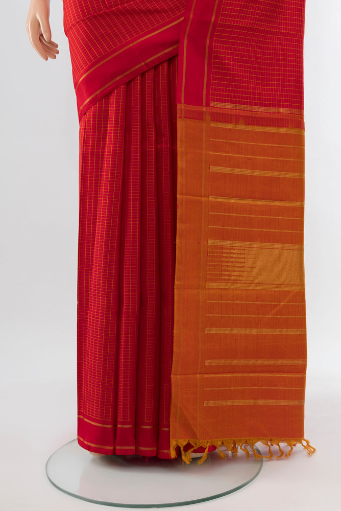Pleats and pallu of Red Kanjivaram Silk Saree with Zari Butta on the body and Silk Border. 