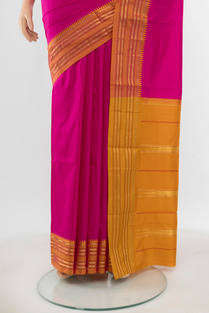 Pleats and pallu of Pure Silk Pure Zari Magenta Narayanpet Saree with Zari Butta on the body and Silk Border. 