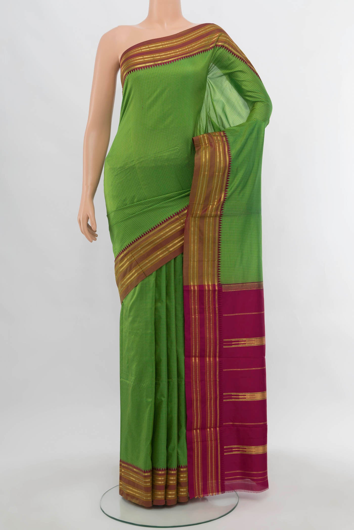 Light Green Narayanpet Silk Saree with Zari Butta on the body and Silk Border.  displayed on a mannequin