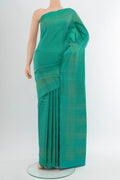 Peacock Blue Soft Silk Saree with Zari Butta on the body and Silk Border.  displayed on a mannequin