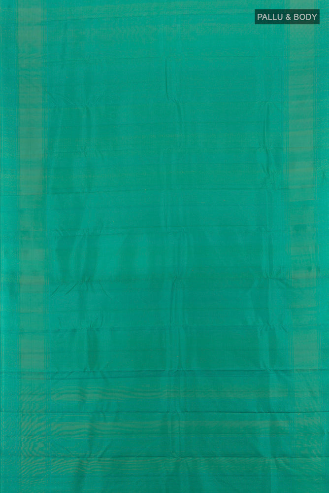 Flat view of Peacock Blue Soft Silk Saree with Zari Butta on the body and Silk Border. 