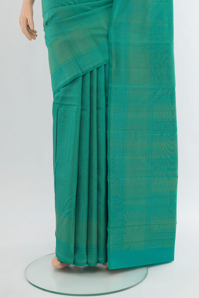 Pleats and pallu of Peacock Blue Soft Silk Saree with Zari Butta on the body and Silk Border. 