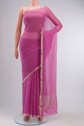 Pink Chiffon Saree with Plain Body and Zari Border displayed on a mannequin