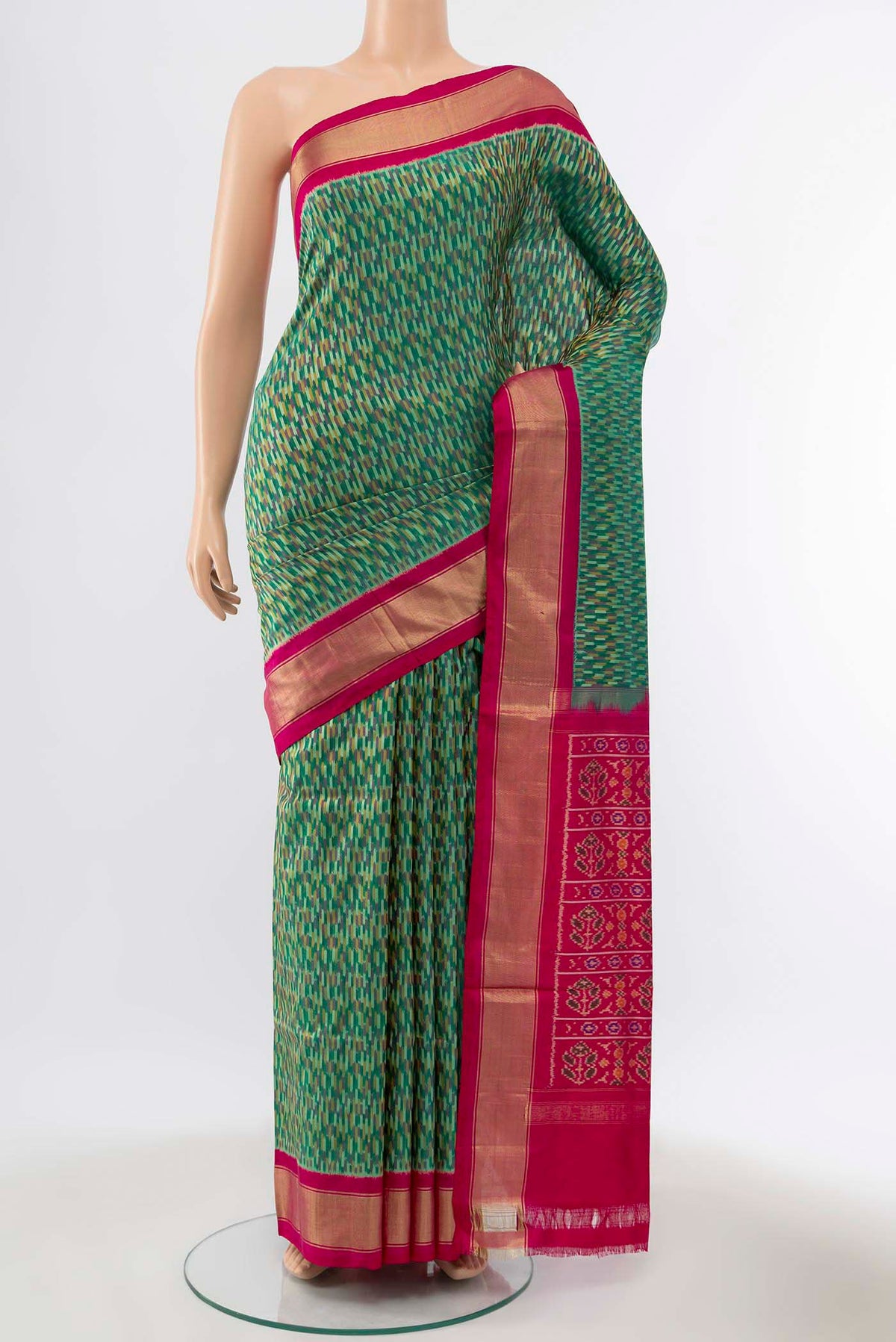 Green Pochampally Silk Saree with Ikat Print on the body and Silk Border displayed on a mannequin