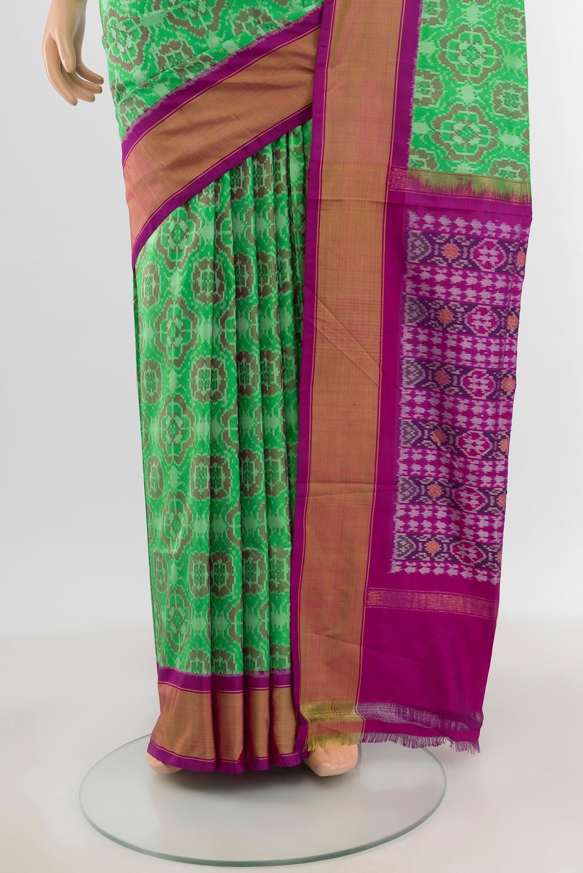 Pleats and pallu of Mint Green Pochampally Silk Saree with Ikat design on the body and Zari Border. 