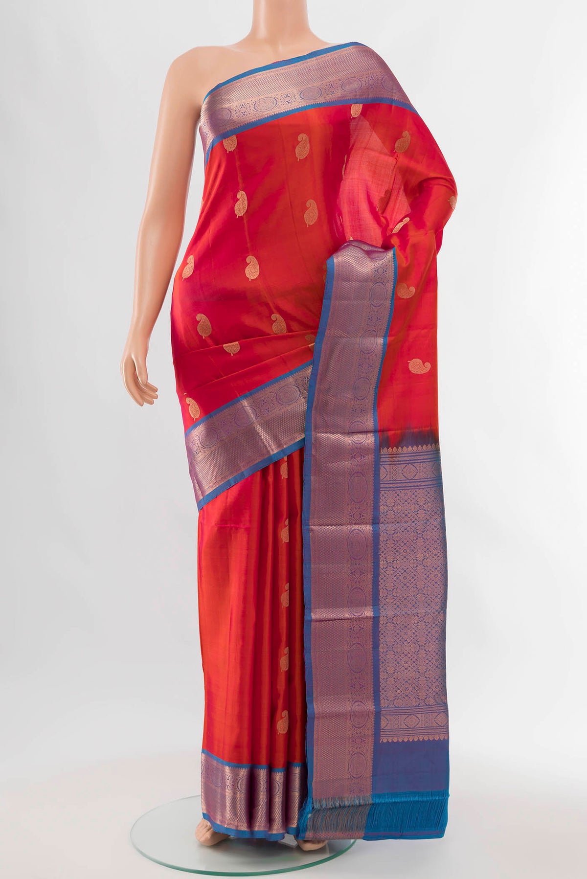 Peach Kanchipuram Silk Saree with Zari Butta on the body and Silk Border displayed on a mannequin