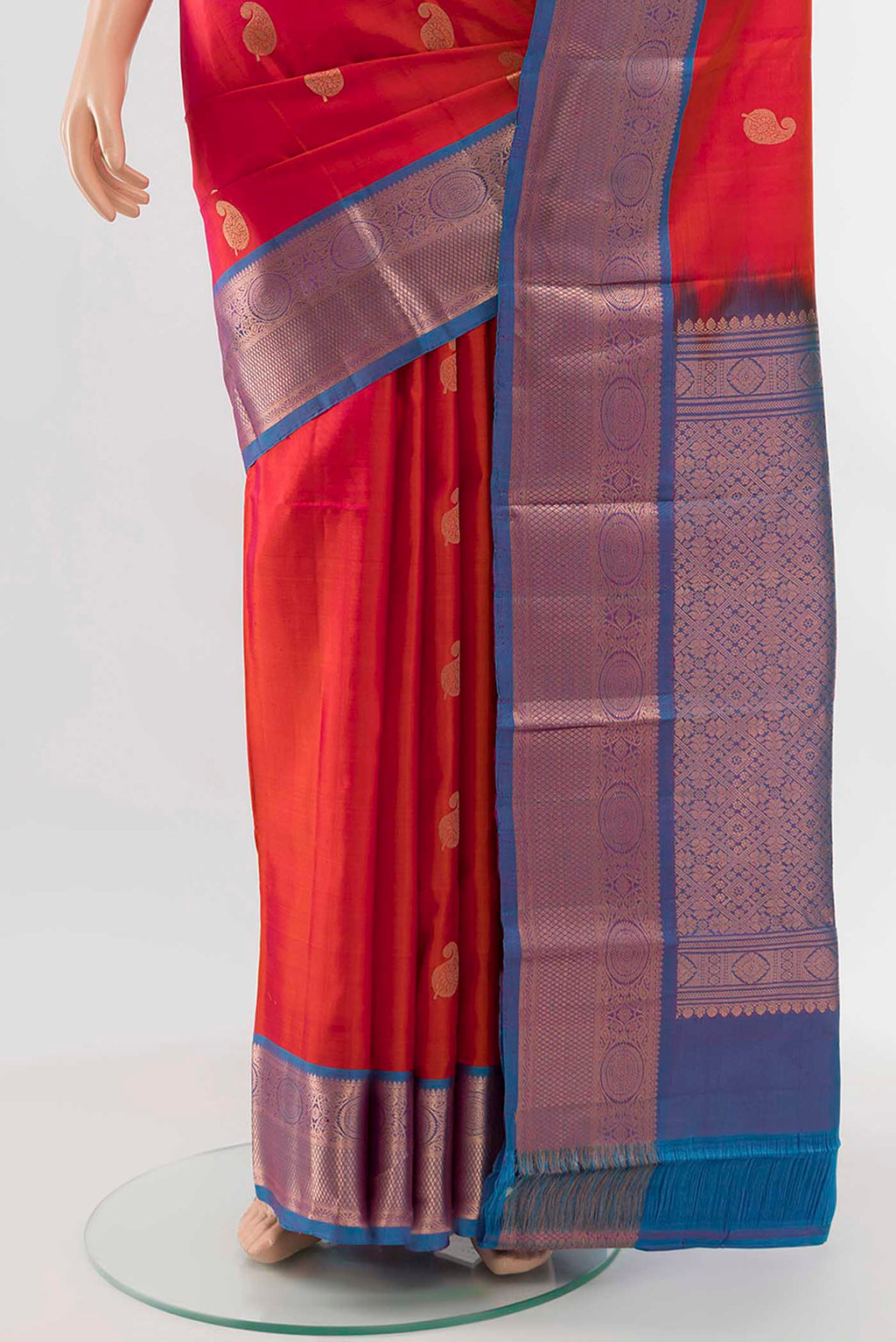 Pleats and pallu of Peach Kanchipuram Silk Saree with Zari Butta on the body and Silk Border