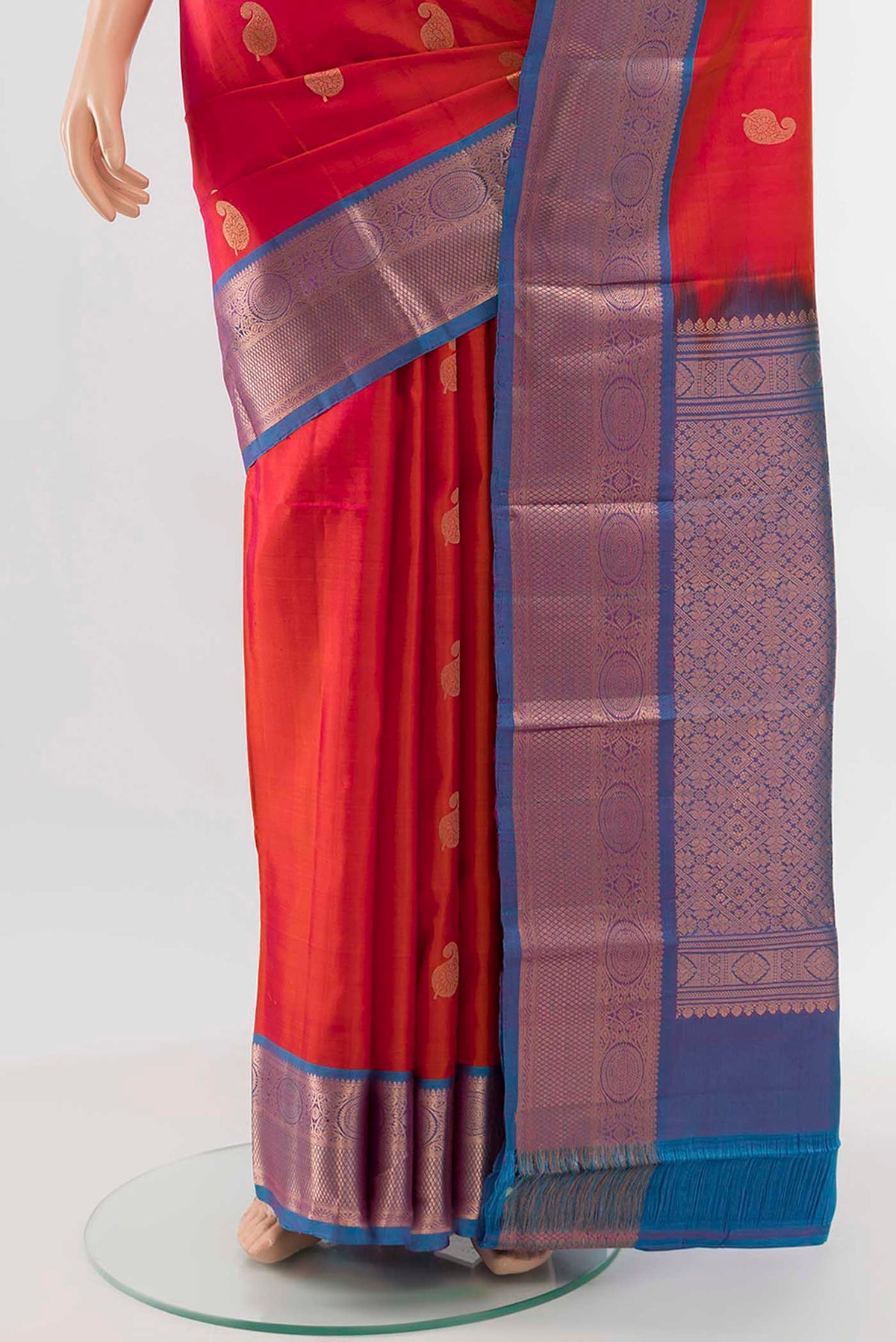Pleats and pallu of Peach Kanchipuram Silk Saree with Zari Butta on the body and Silk Border