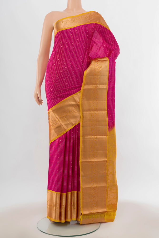 Magenta Kanchipuram Silk Saree with Zari Butta on the body and Silk Border.  displayed on a mannequin
