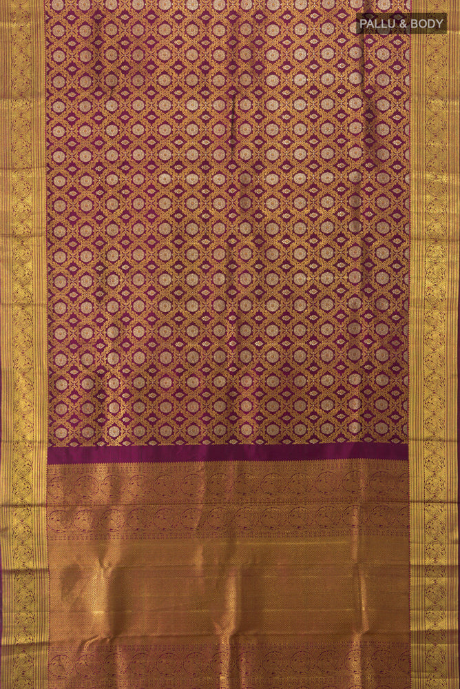 Flat view of Purple Kanchipuram Silk Saree with Zari Butta on the body and Silk Border. 