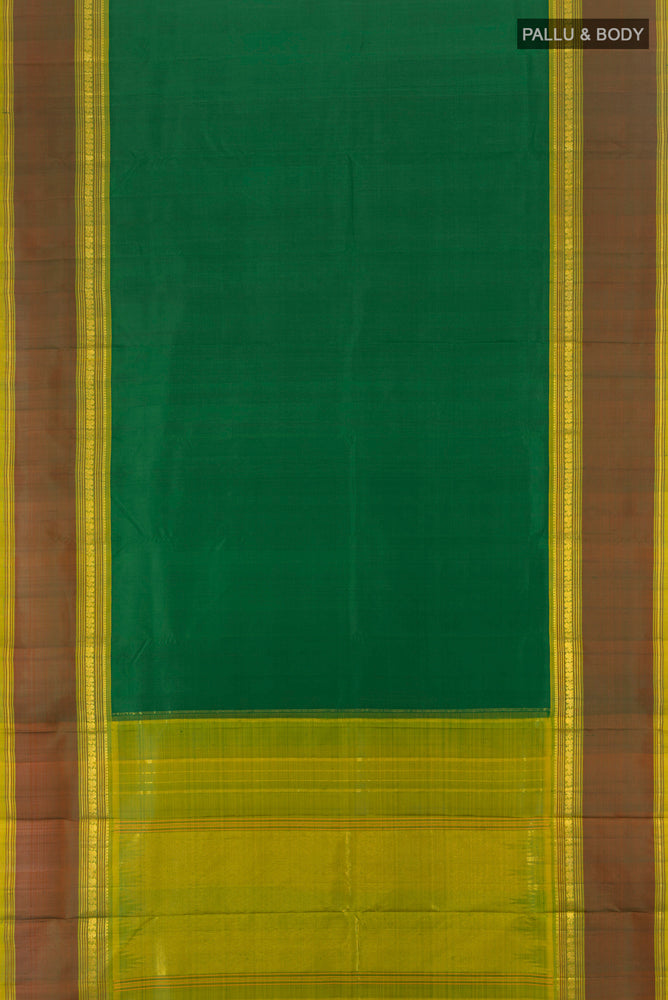 Flat view of Pure Silk Pure Zari Light Green Kanchipuram Saree with Zari Butta on the body and Silk Border. 