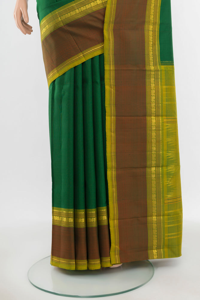 Pleats and pallu of Pure Silk Pure Zari Light Green Kanchipuram Saree with Zari Butta on the body and Silk Border. 