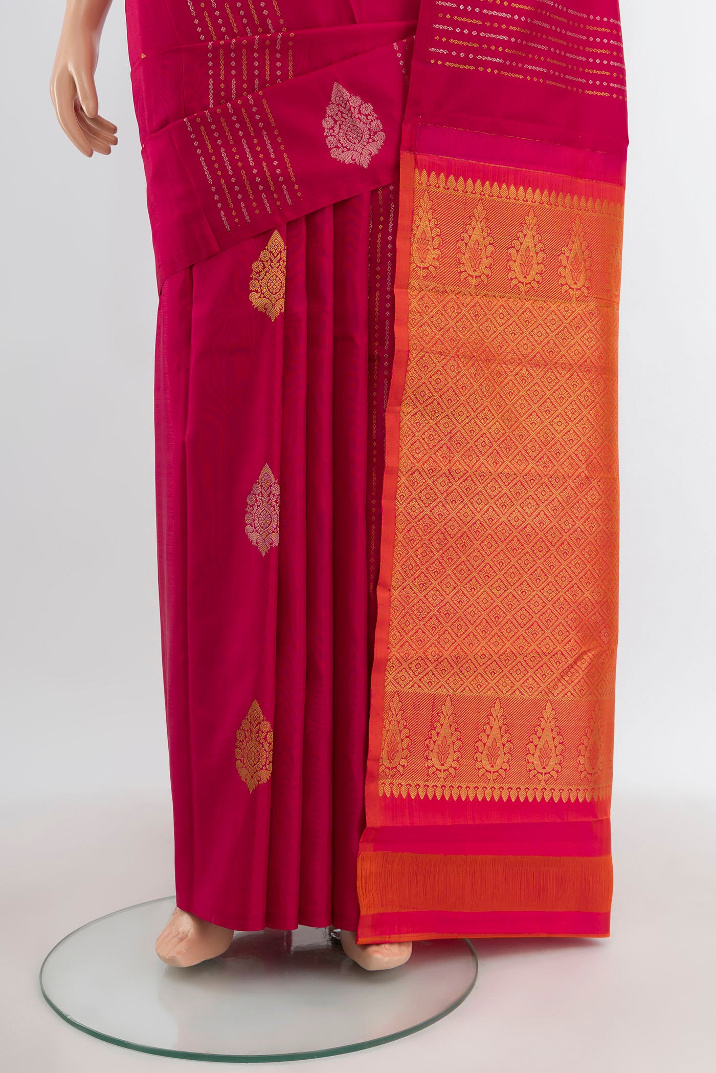 Pleats and pallu of Dark Pink Kanjivaram Silk Saree with Zari Butta on the body and Without Border. 