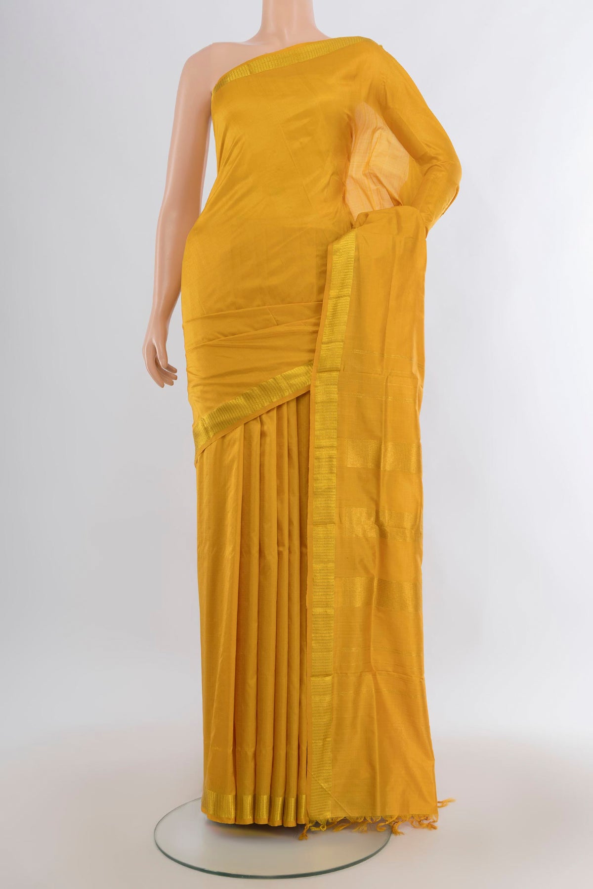Pure Silk Mustard Kanjivaram Nine Yards Saree with Plain Body and Zari Border.  displayed on a mannequin