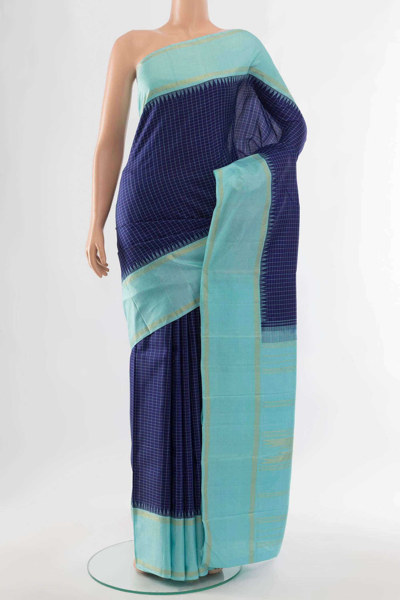 Navy Blue Kanjivaram Silk Saree with Zari Butta on the body and Silk Border.  displayed on a mannequin