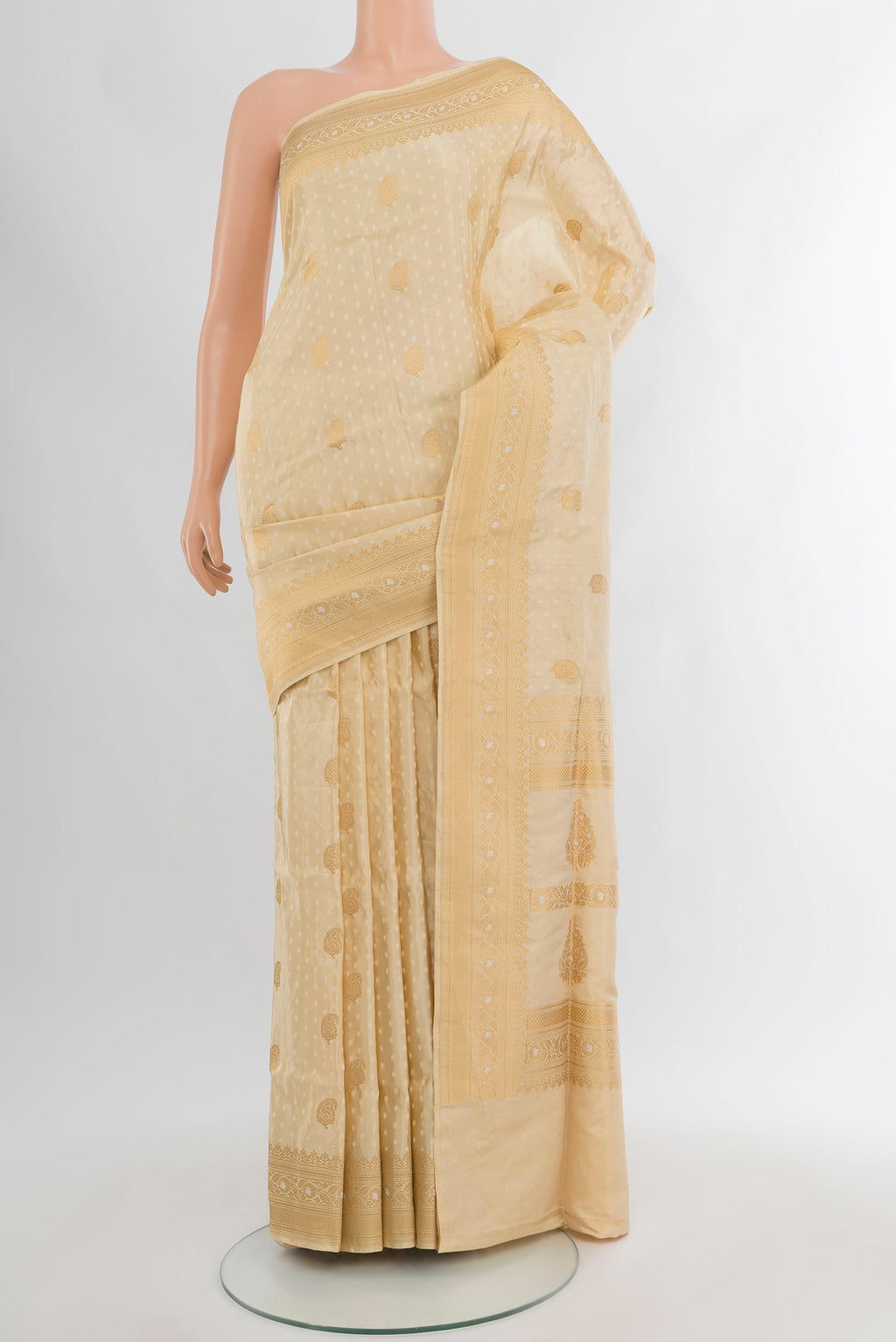 Sandal Banarasi Silk Saree with Jacquard With Thread Butta on the body and Zari Border.  displayed on a mannequin
