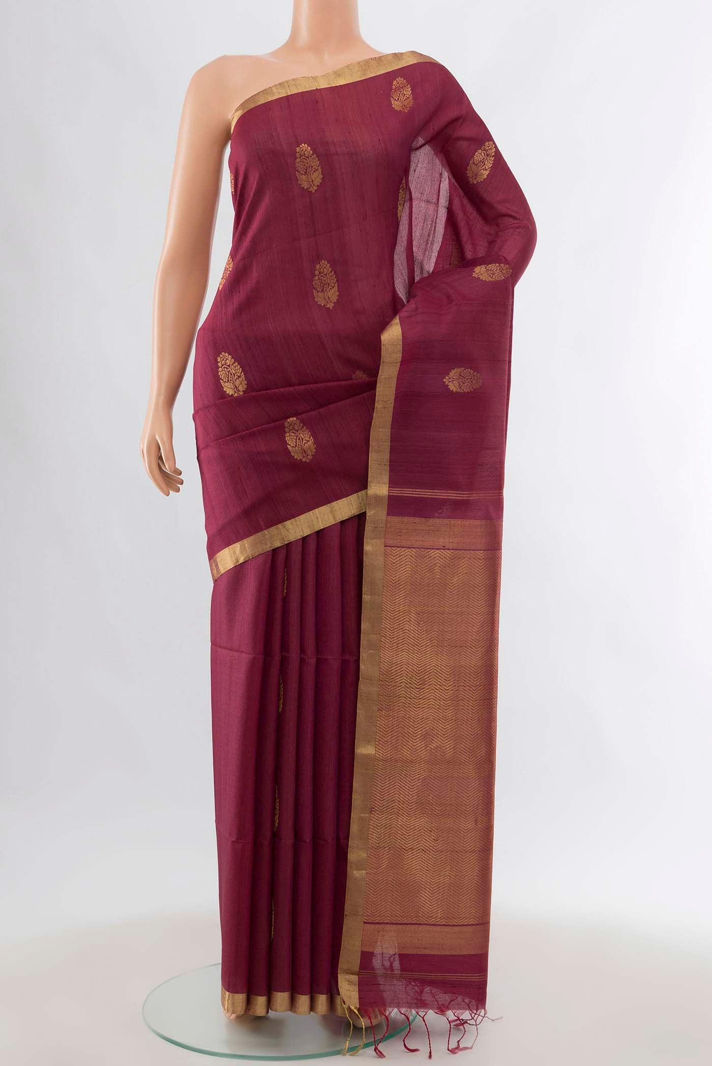 Maroon Tussar Silk Saree with Zari Butta on the body and Silk Border displayed on a mannequin
