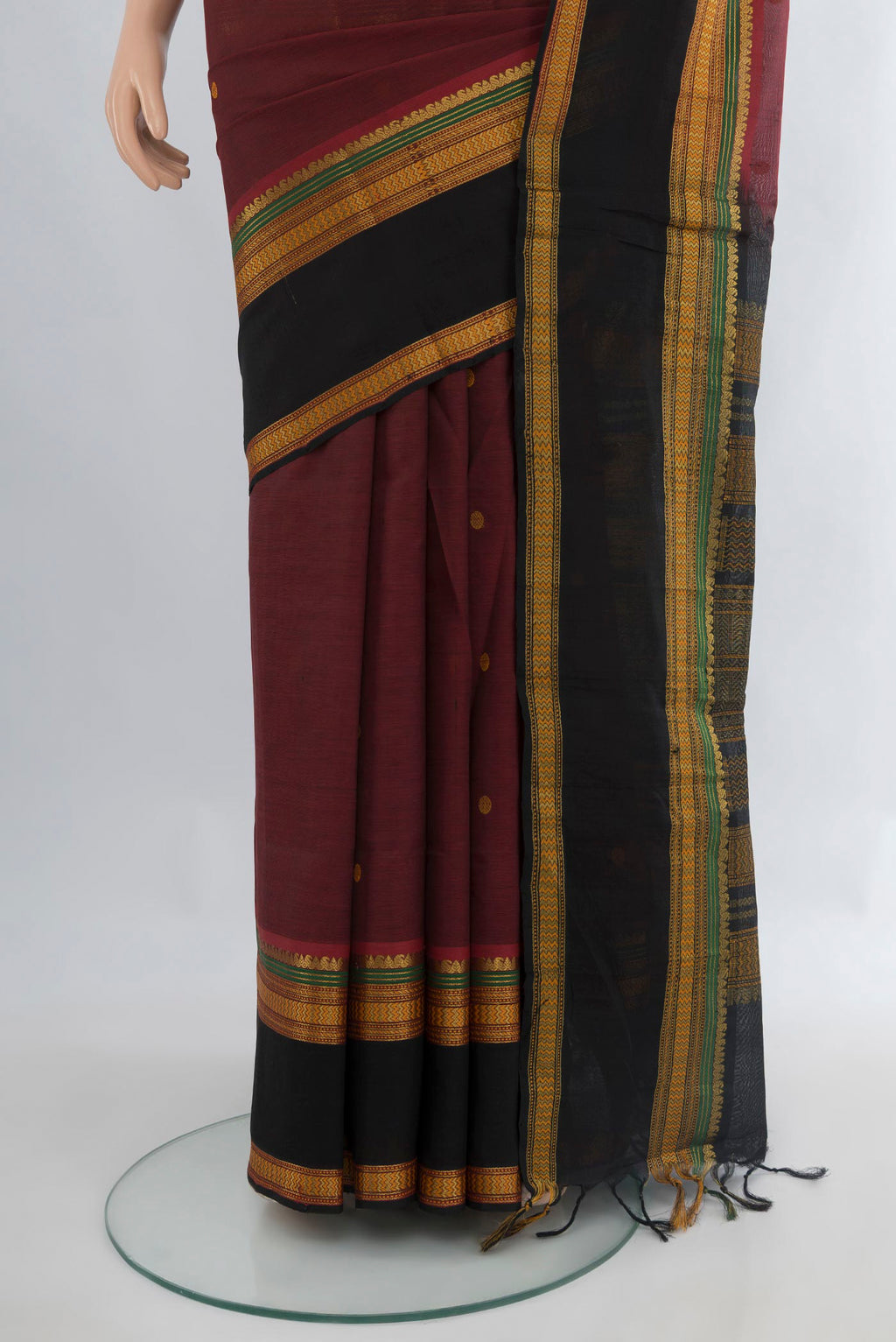 Pleats and pallu of Maroon Silk Cotton Saree with Thread Butta on the body and Zari Border. 