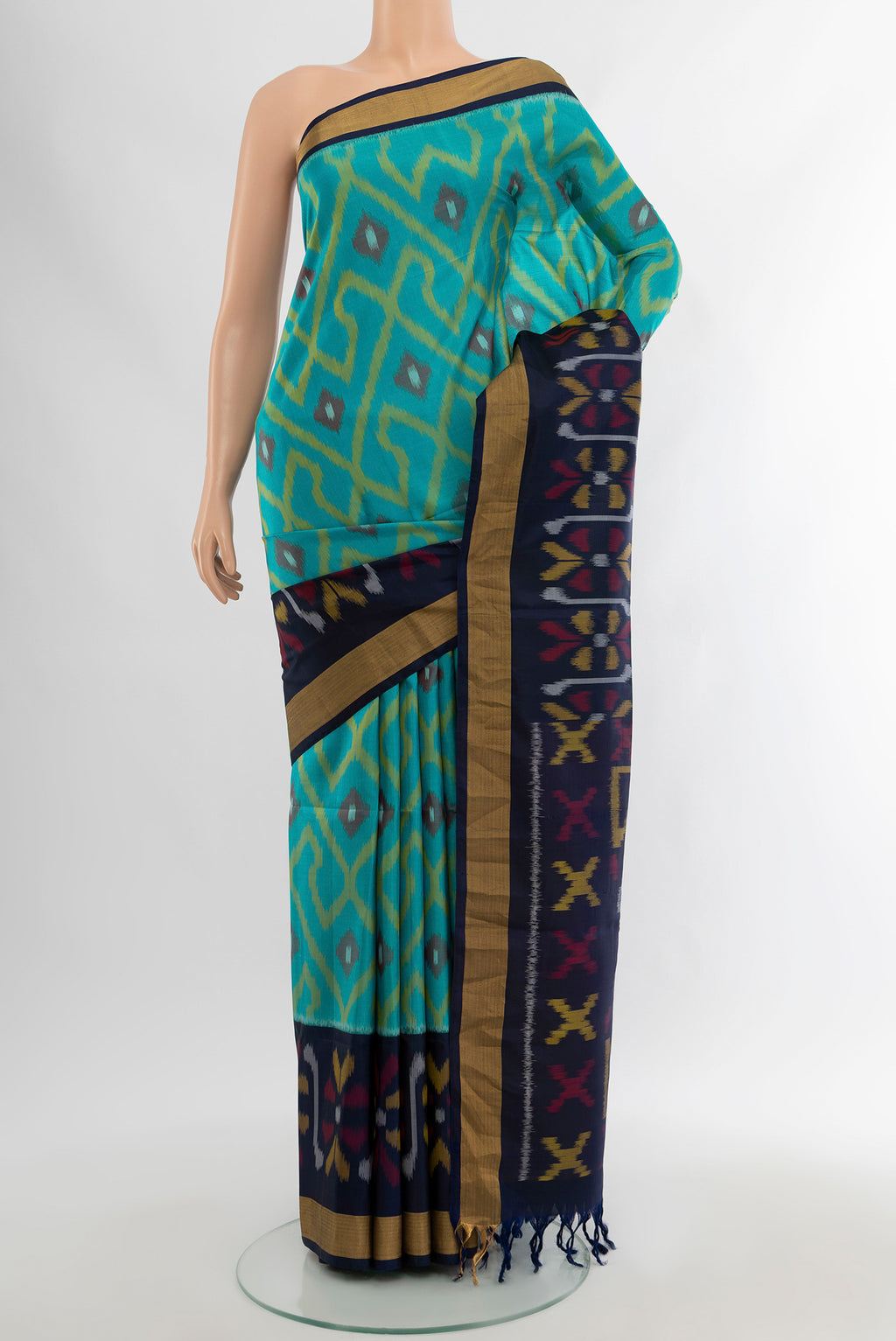 Light Blue Soft Silk Saree with Ikat Print on the body and Zari Border.  displayed on a mannequin