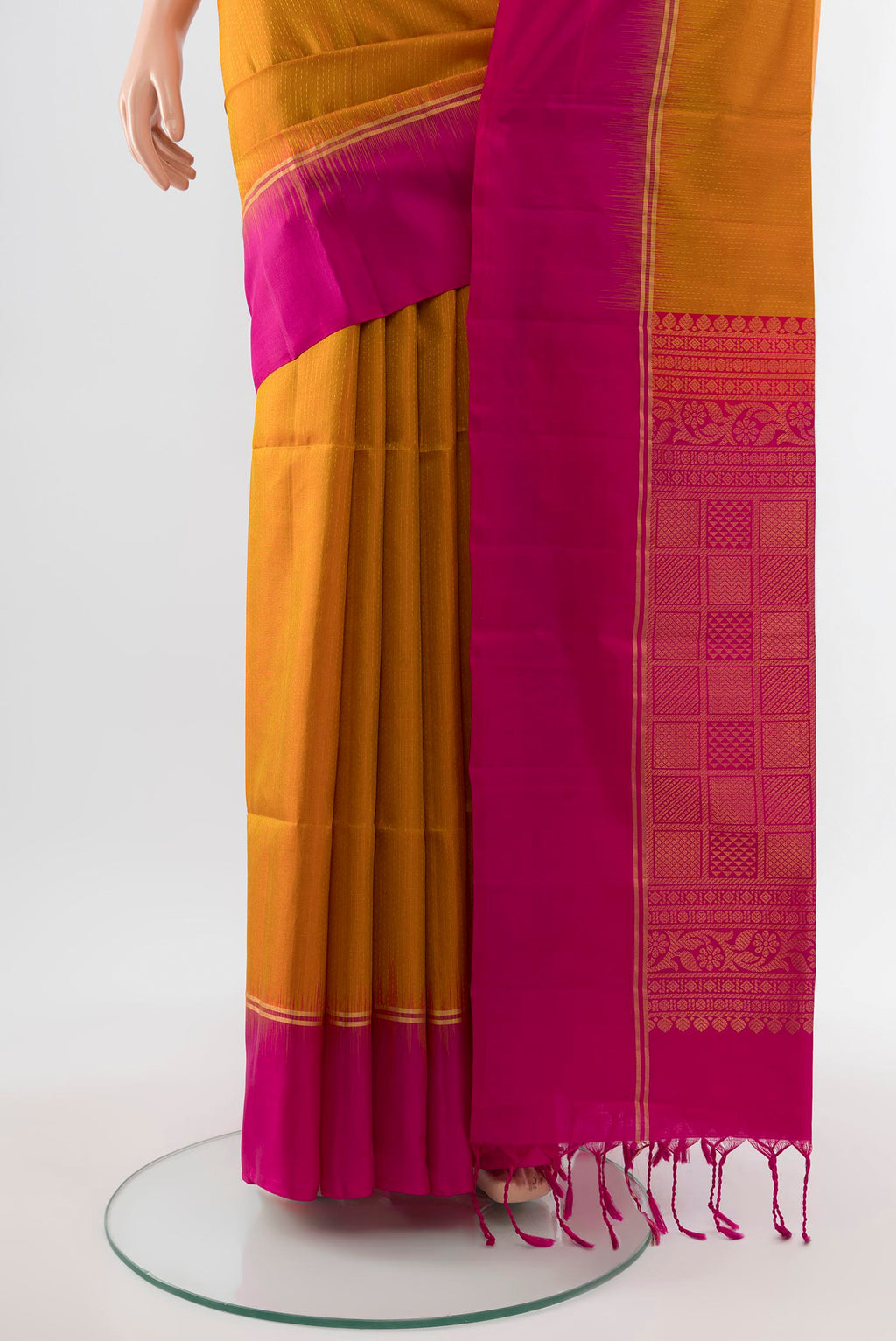 Pleats and pallu of Mustard Soft Silk Saree with Zari Butta on the body and Silk Border. 