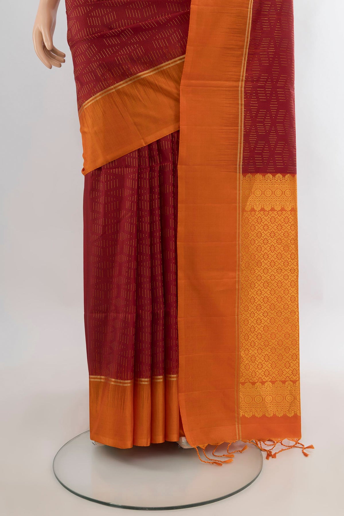 Pleats and pallu of Pure Silk Red Soft Saree with Zari Butta on the body and Plain Border. 