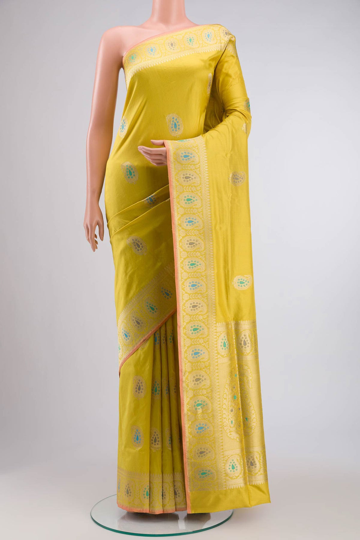 Yellow Banarasi Silk Saree with Zari Butta on the body and Zari Border displayed on a mannequin