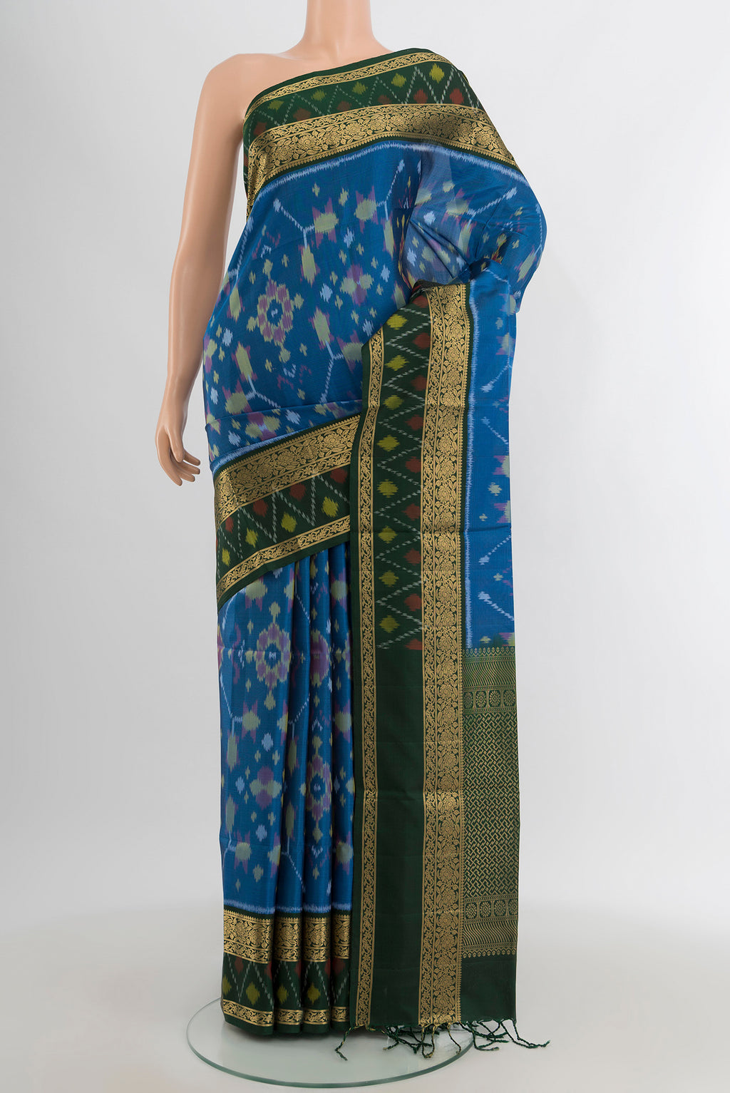 Light Blue Soft Silk Saree with Ikat design on the body and Zari Border.  displayed on a mannequin
