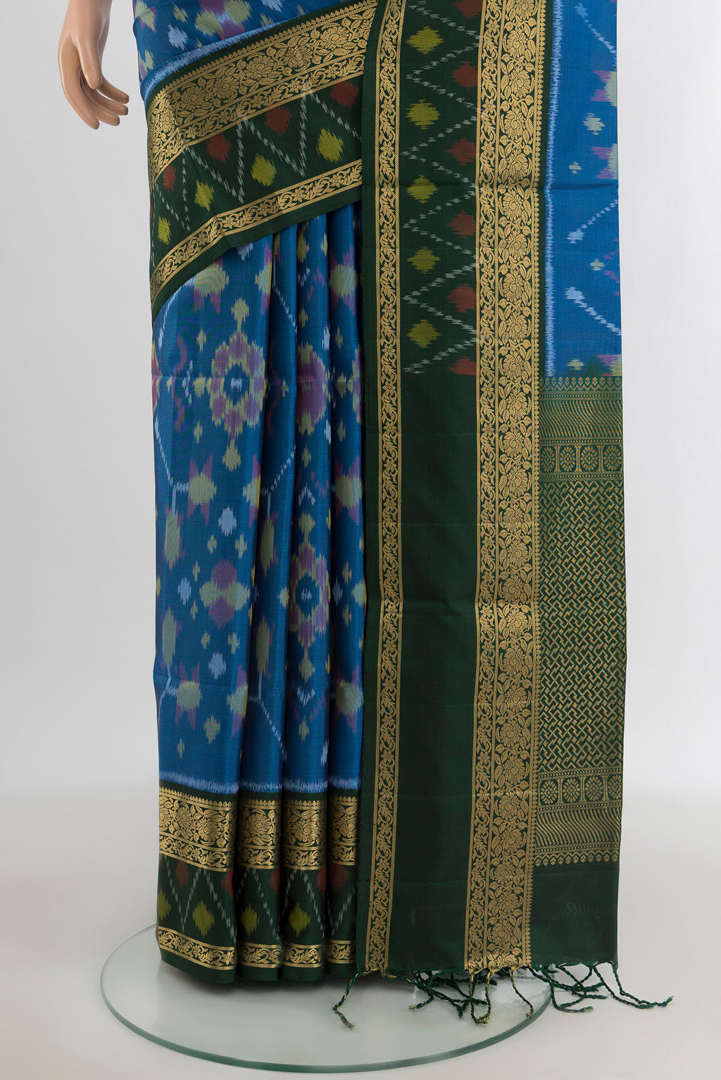 Pleats and pallu of Light Blue Soft Silk Saree with Ikat design on the body and Zari Border. 
